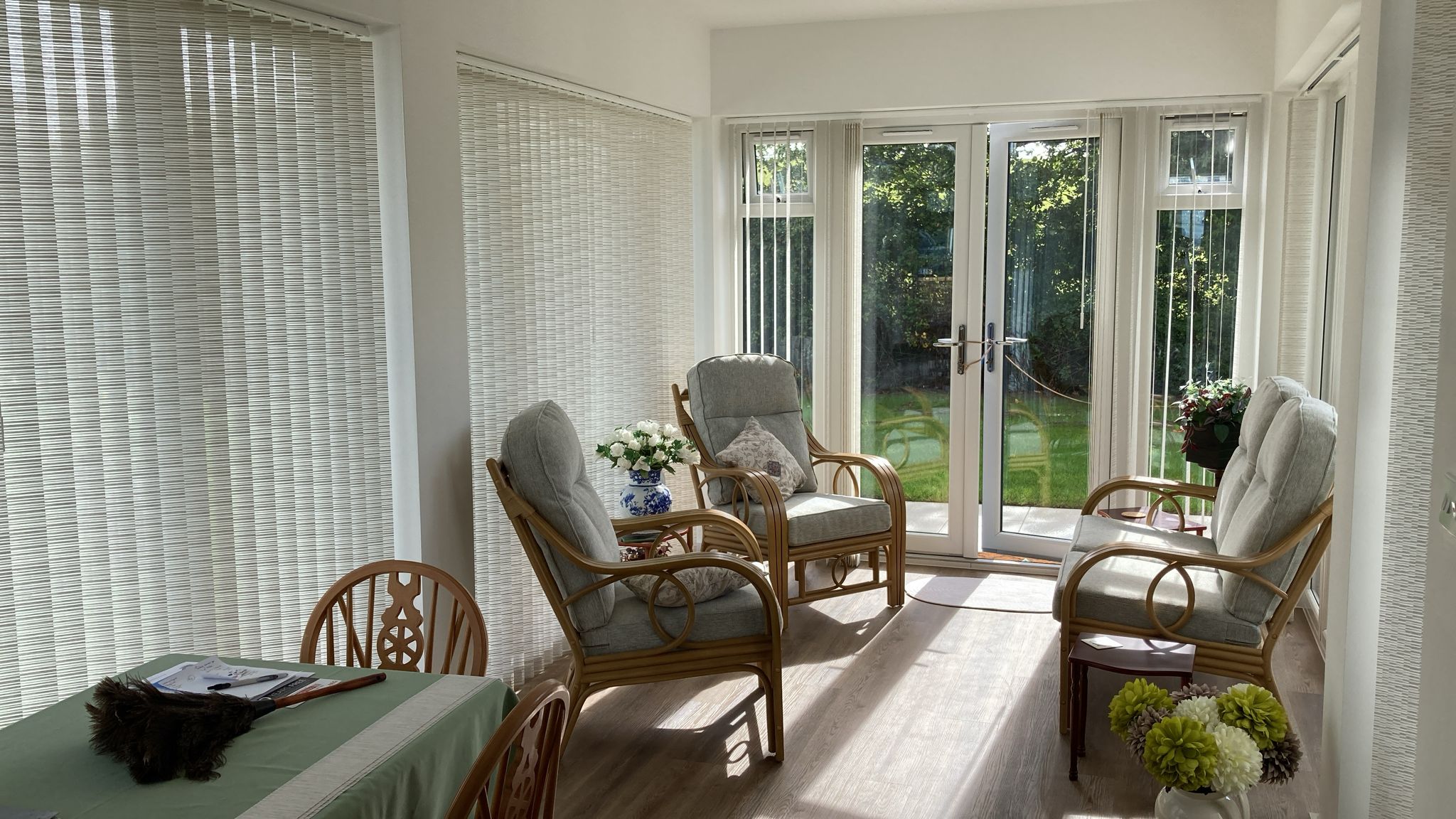 Vertical blinds installed across large conservatory windows and doors